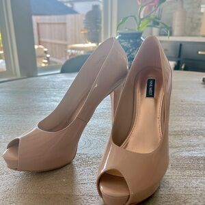 Nude, peep-toe, platform stilettos. Nine West size 10M